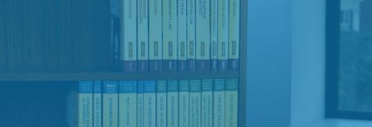 blue overlaid image of a bookcase with NCLC's treatises