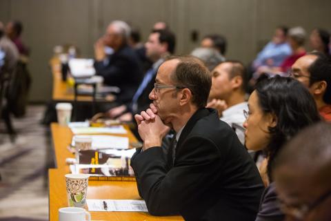 photo of conference attendees in a session